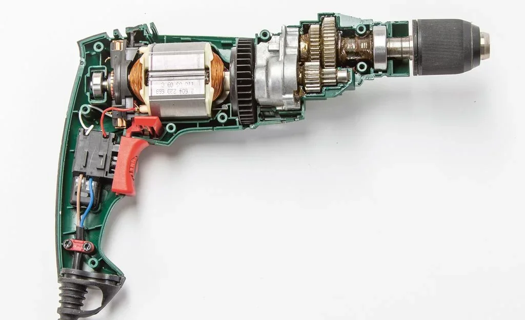 Cutaway photo of an electric drill showing the motor and gears